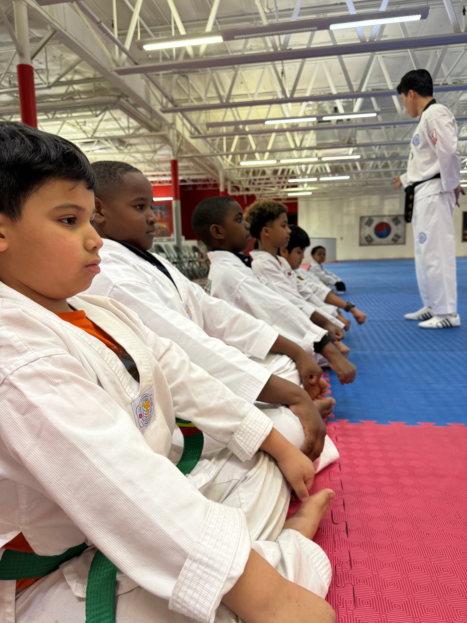 Students in uniform practicing a chamber punch drill together